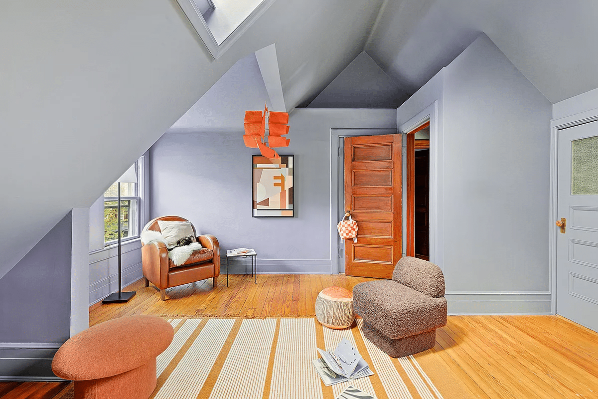 top floor family room with skylight, wood floor