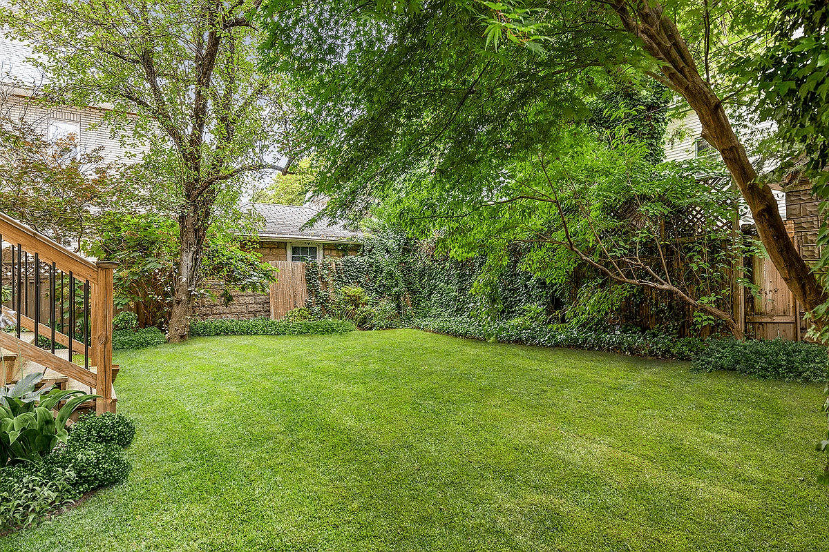 yard with lawn and trees