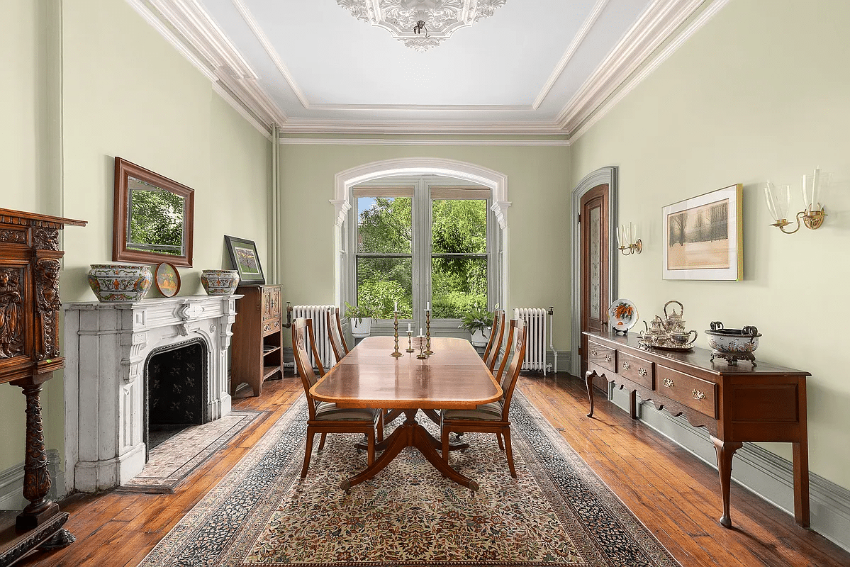 dining room with marble mantel, wood floor