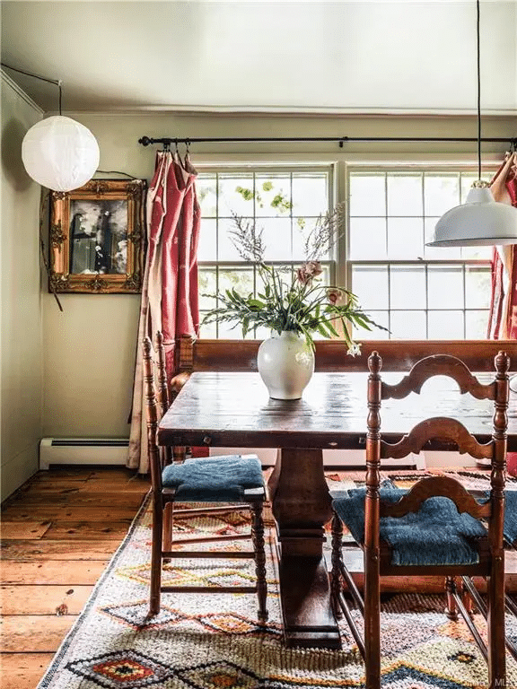 dining room with baseboard heat, wide planked floorboards