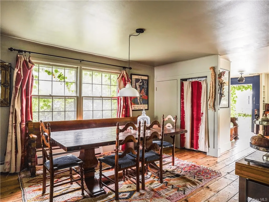 dining room with wide planked floor boards