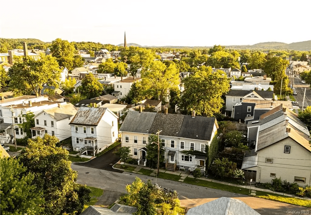 aerial view showing the house and the neighborhood