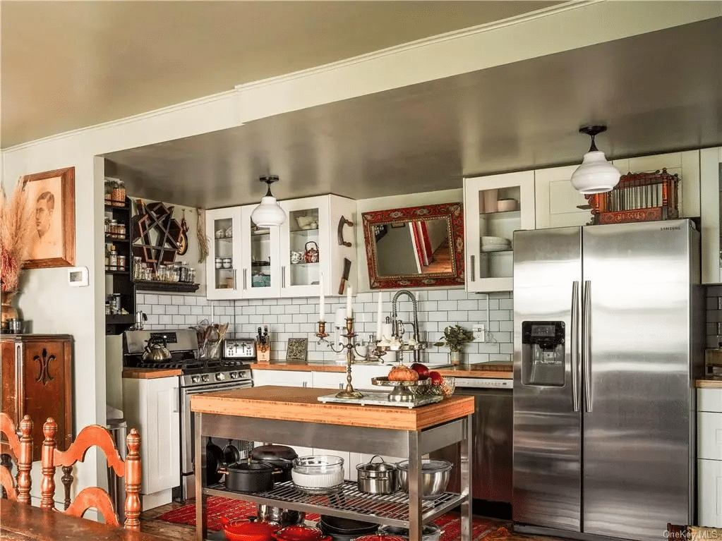 kitchen with white cabinets, stainless steel appliances