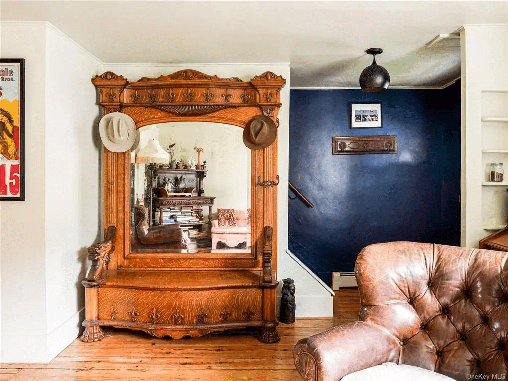 living room with view of blue wall in entry