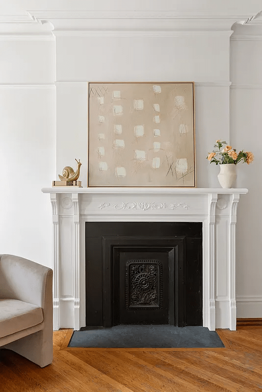 white painted mantel in a bedroom