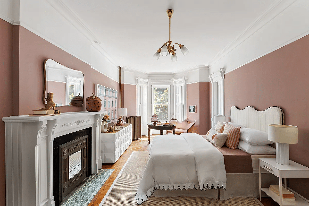 bedroom with white trim, mauve walls, picture rail