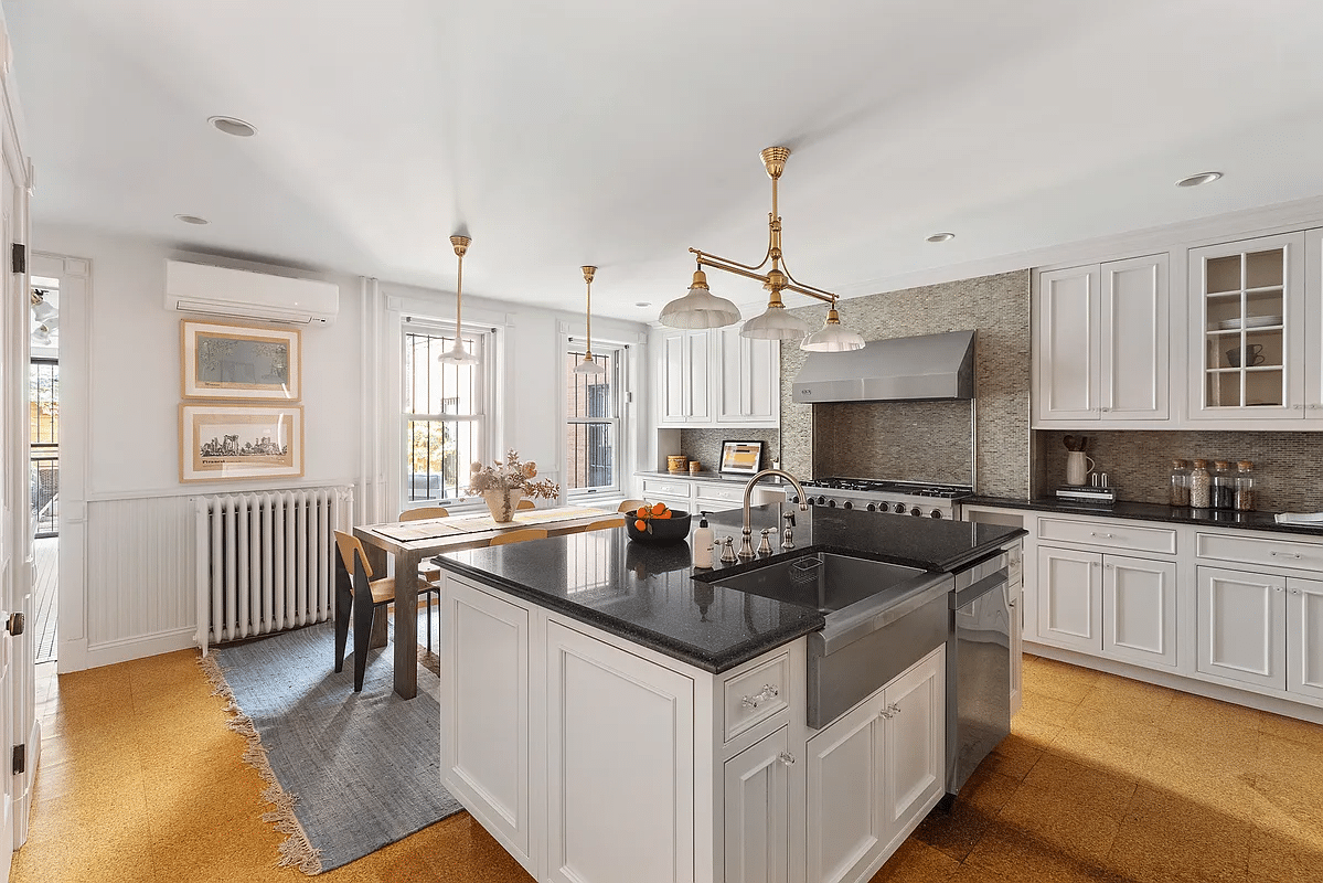 kitchen with white cabinets, large center island