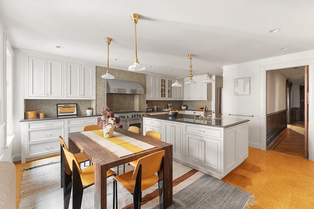 kitchen with white cabinets, large center island