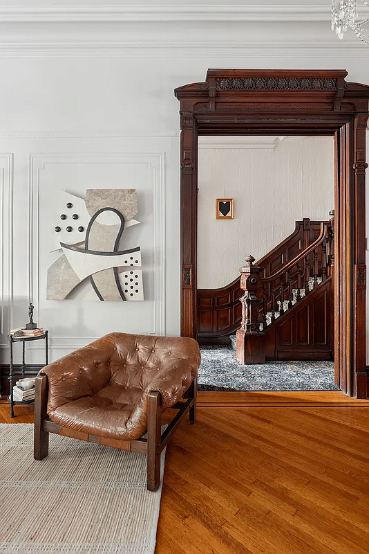 view from front parlor to stair hall with elaborate newel post