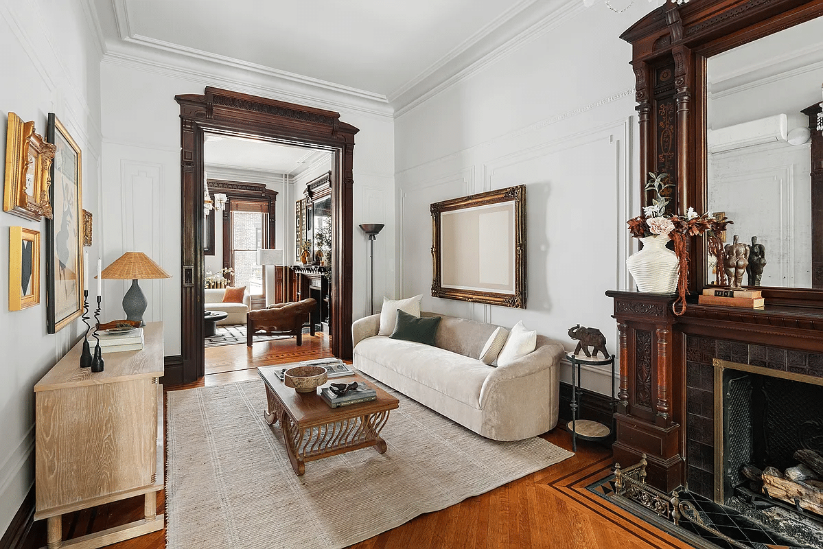 front parlor with wood floor, mantel with mirror