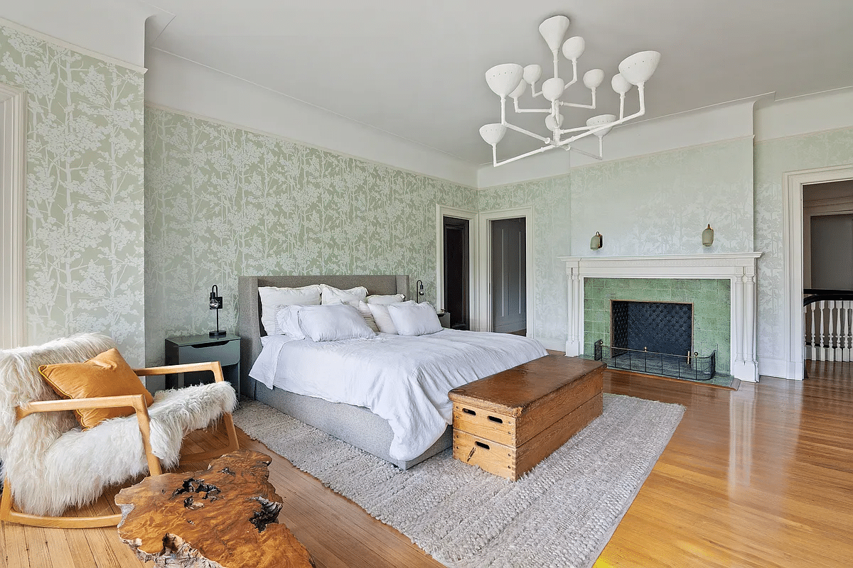 bedroom with green wallpaper, mantel with green tile