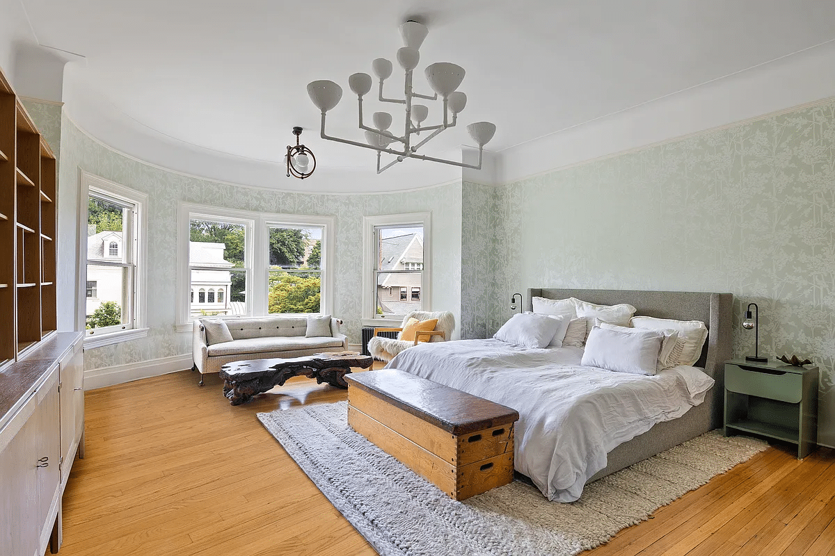 bedroom with curved bay, wood floor