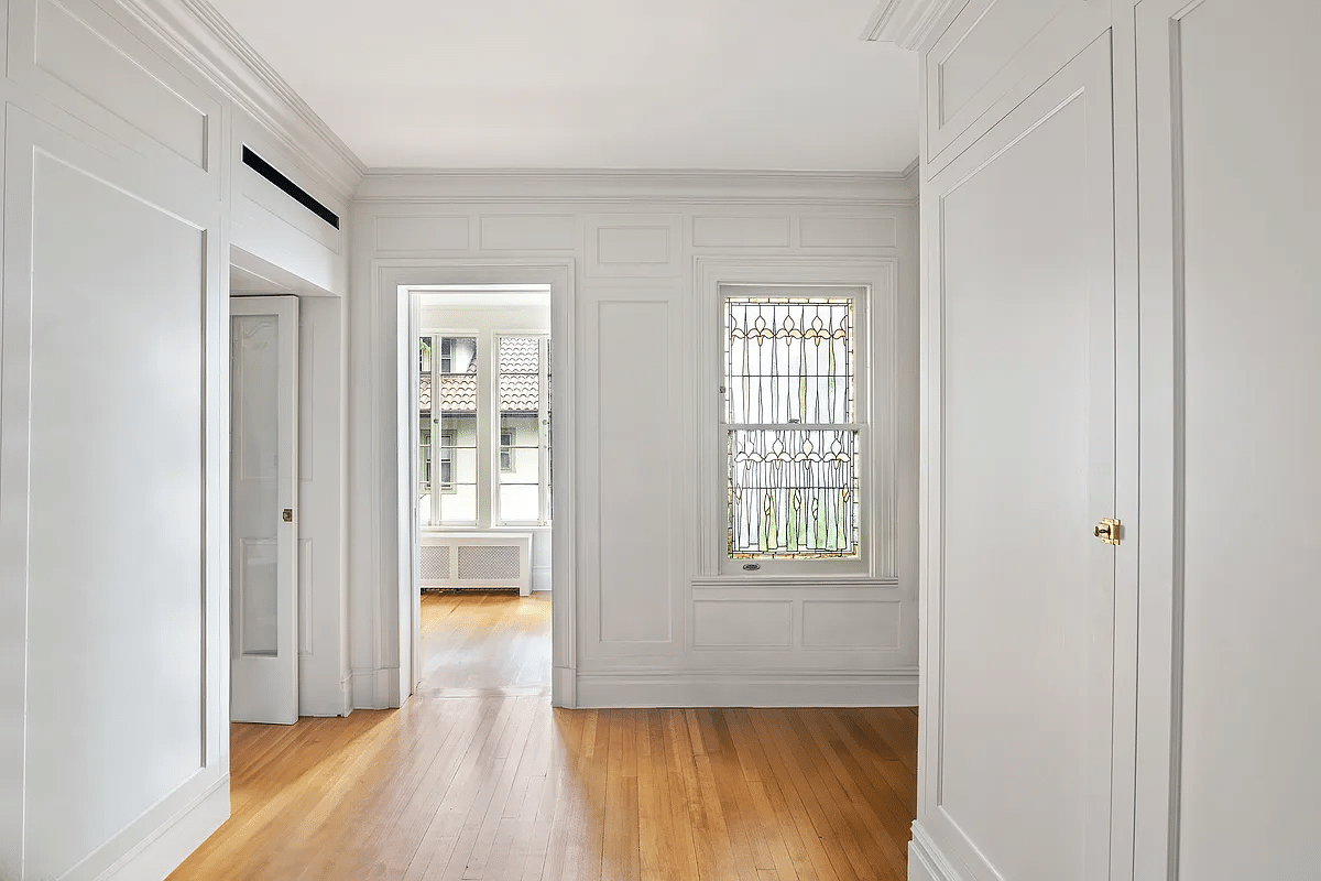 hallway with stained glass window