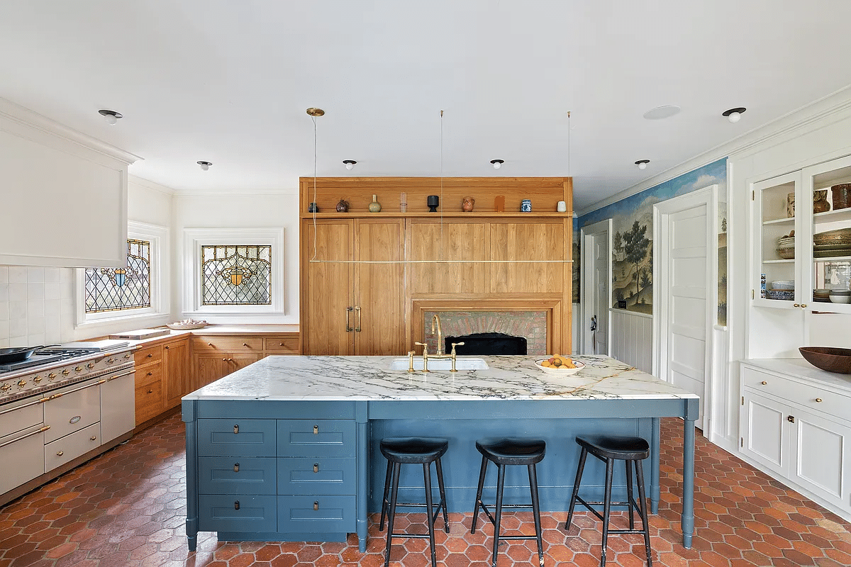 kitchen with terra cotta tile floor, large marble topped island