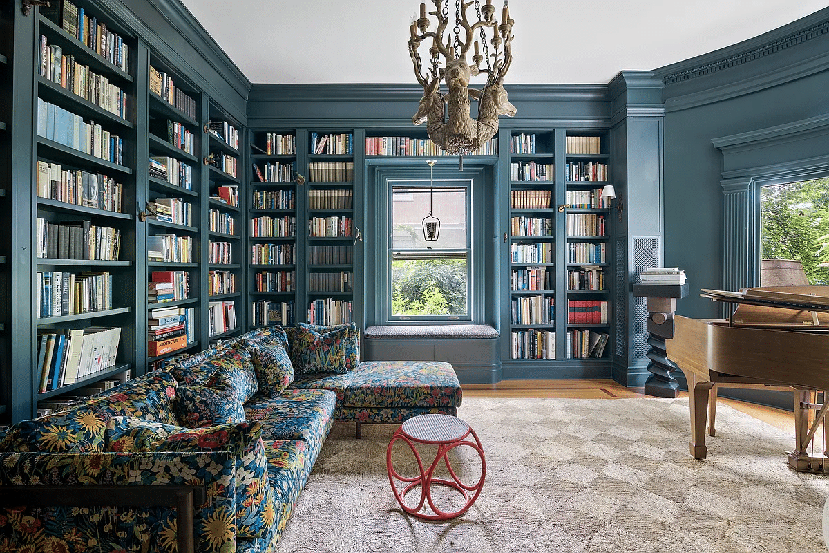 library with built-in shelves and blue walls and trim