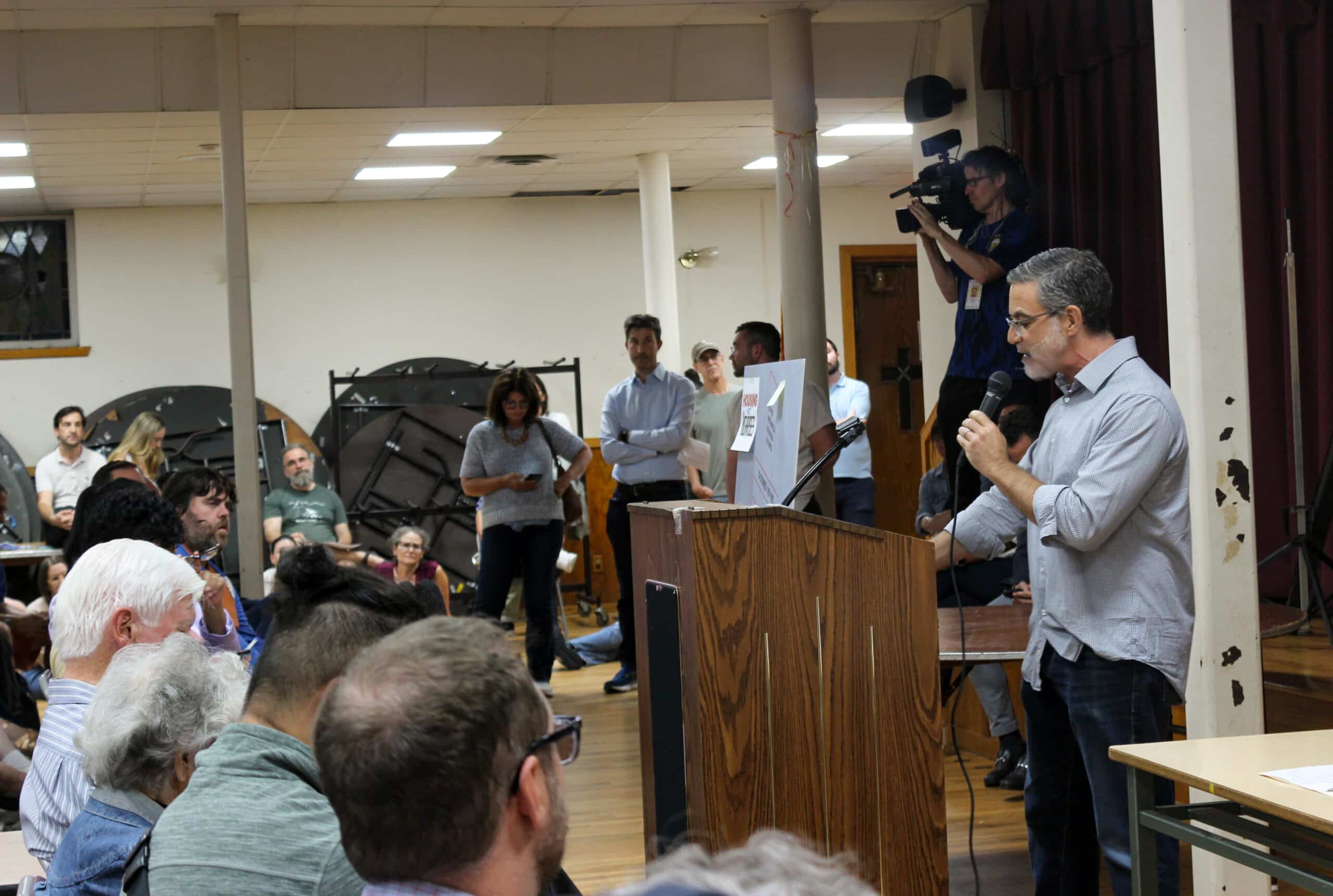 person speaking at a podium