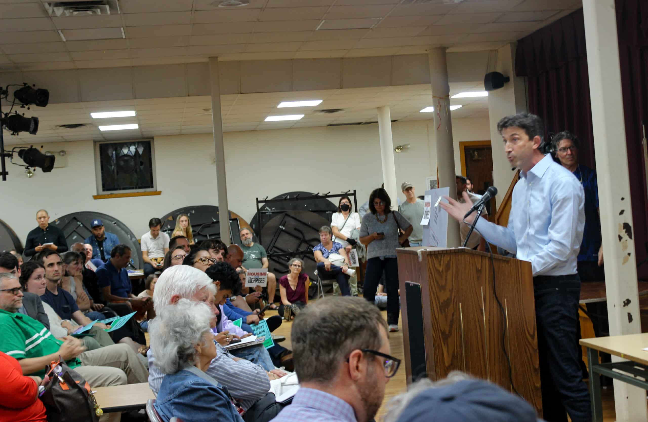 person speaking at a podium