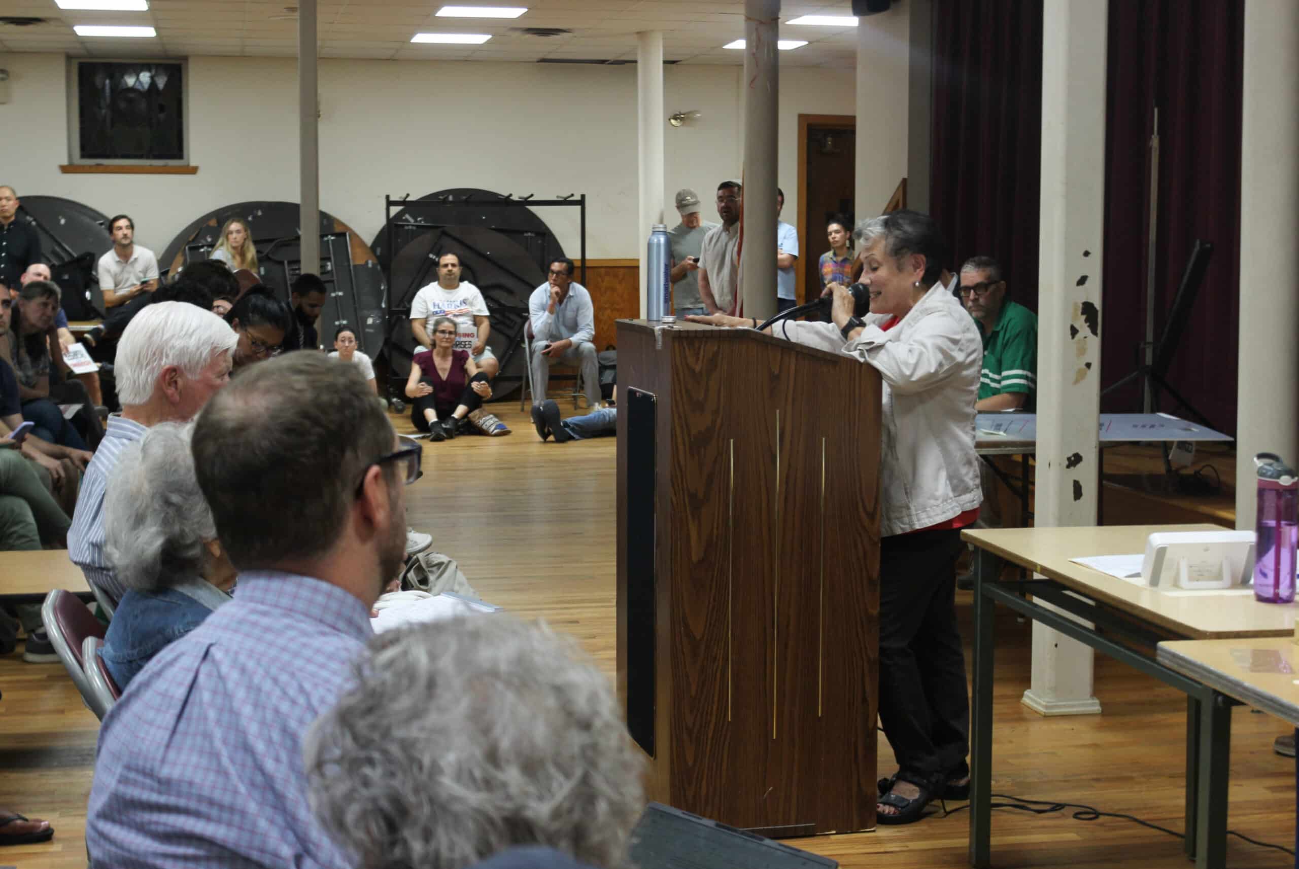 person speaking at a podium