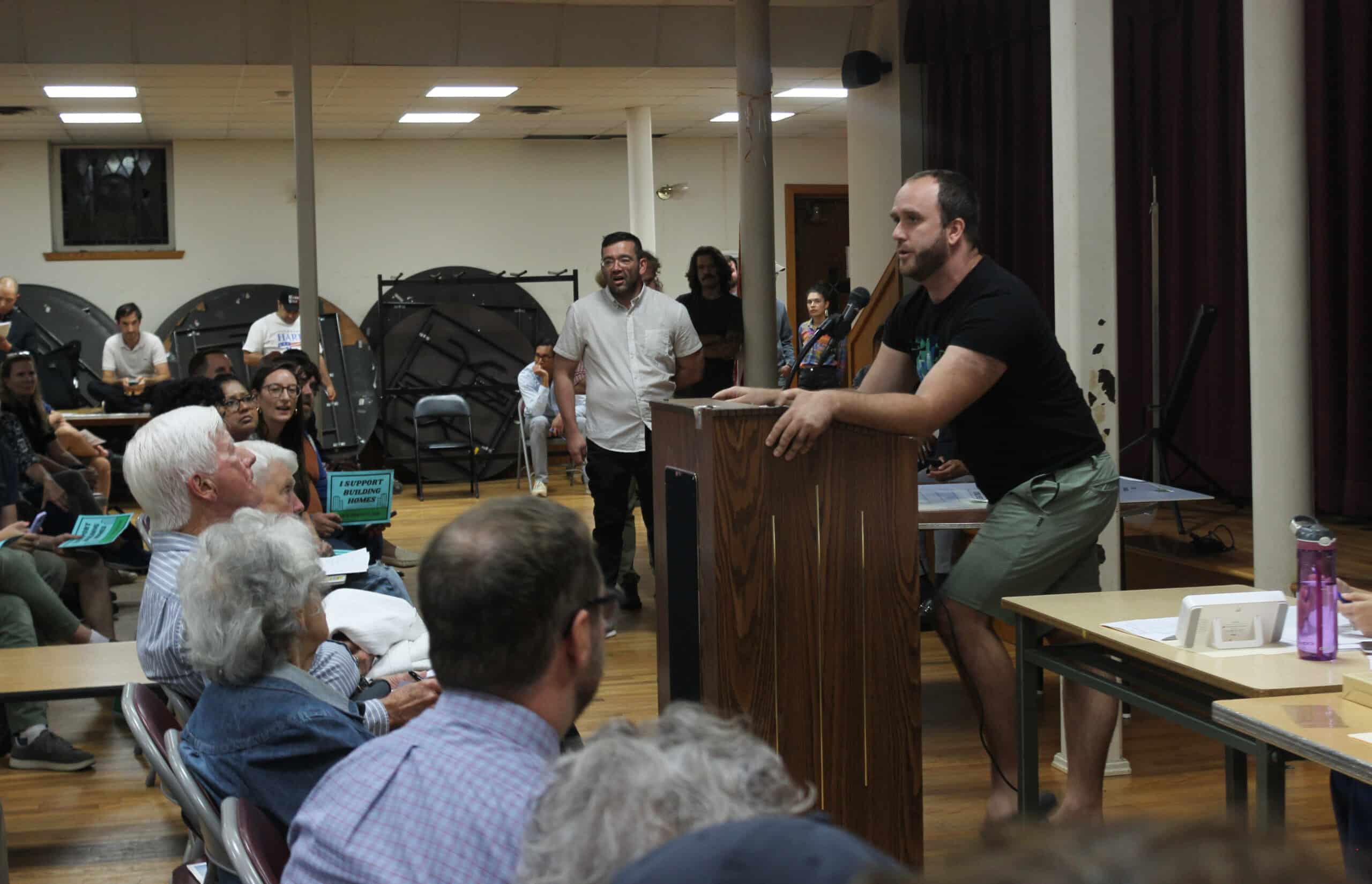 person speaking at a podium