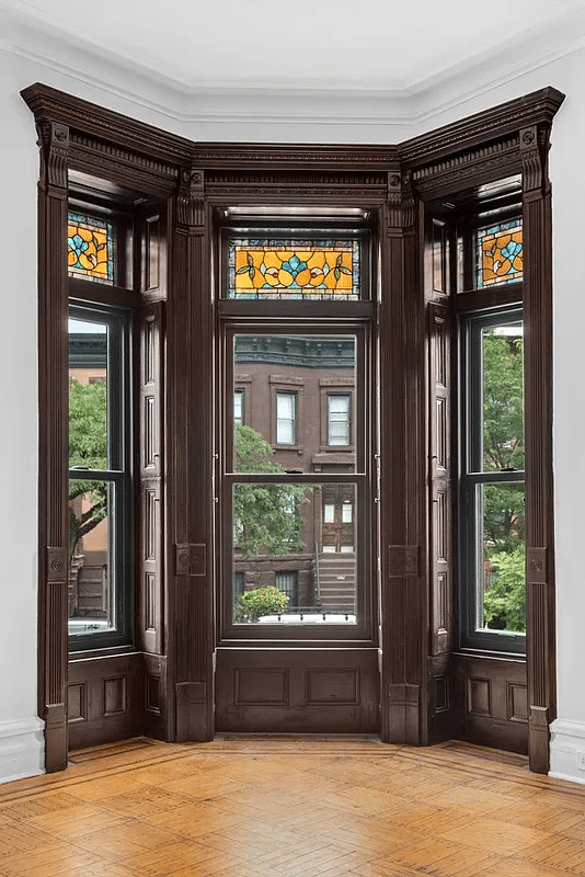 bay window with upper panes of stained glass