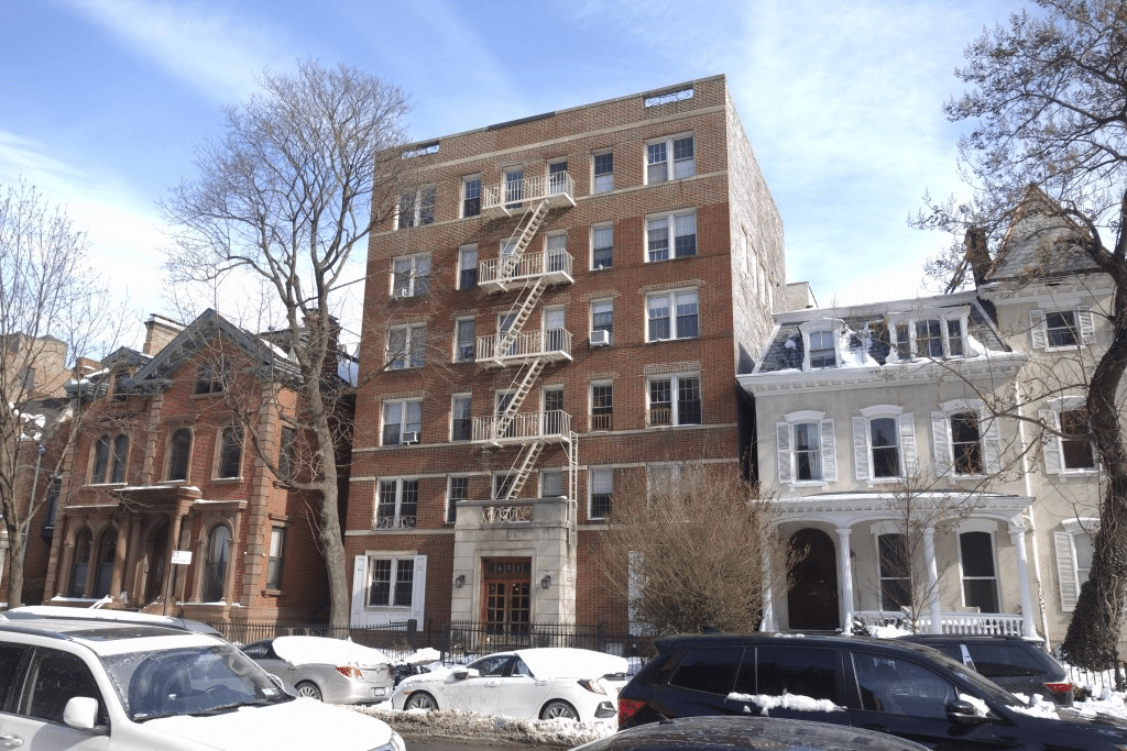 brick apartment building between clinton avenue mansions