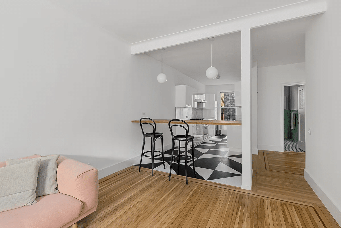 view into kitchen from living room with breakfast bar