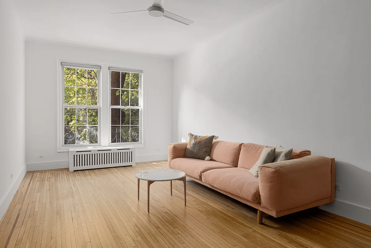 clinton hill - living room with two windows, wood floor, ceiling fan