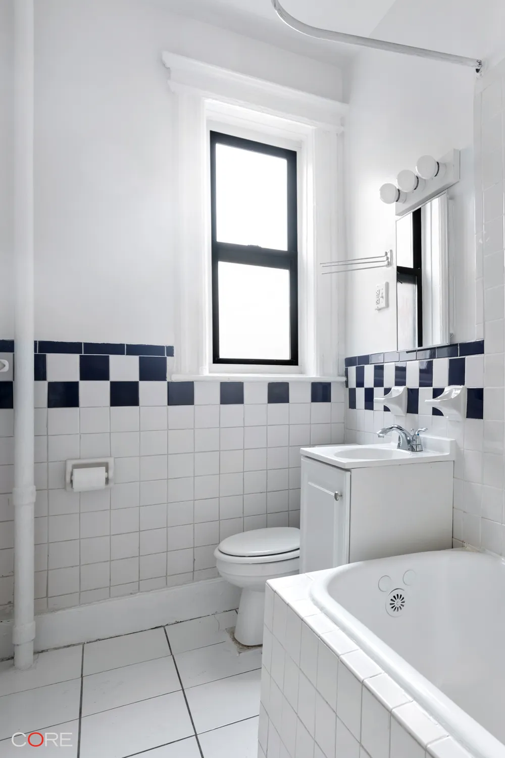 bathroom with black and white tile