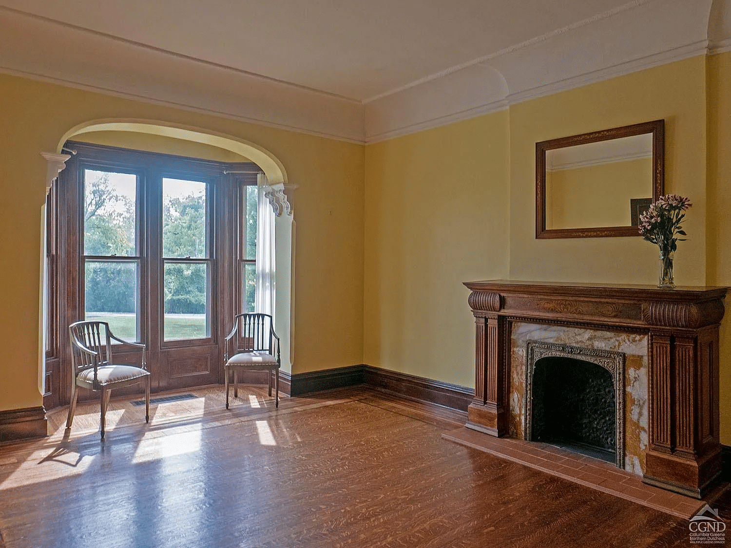 parlor with window niche, wood mantel