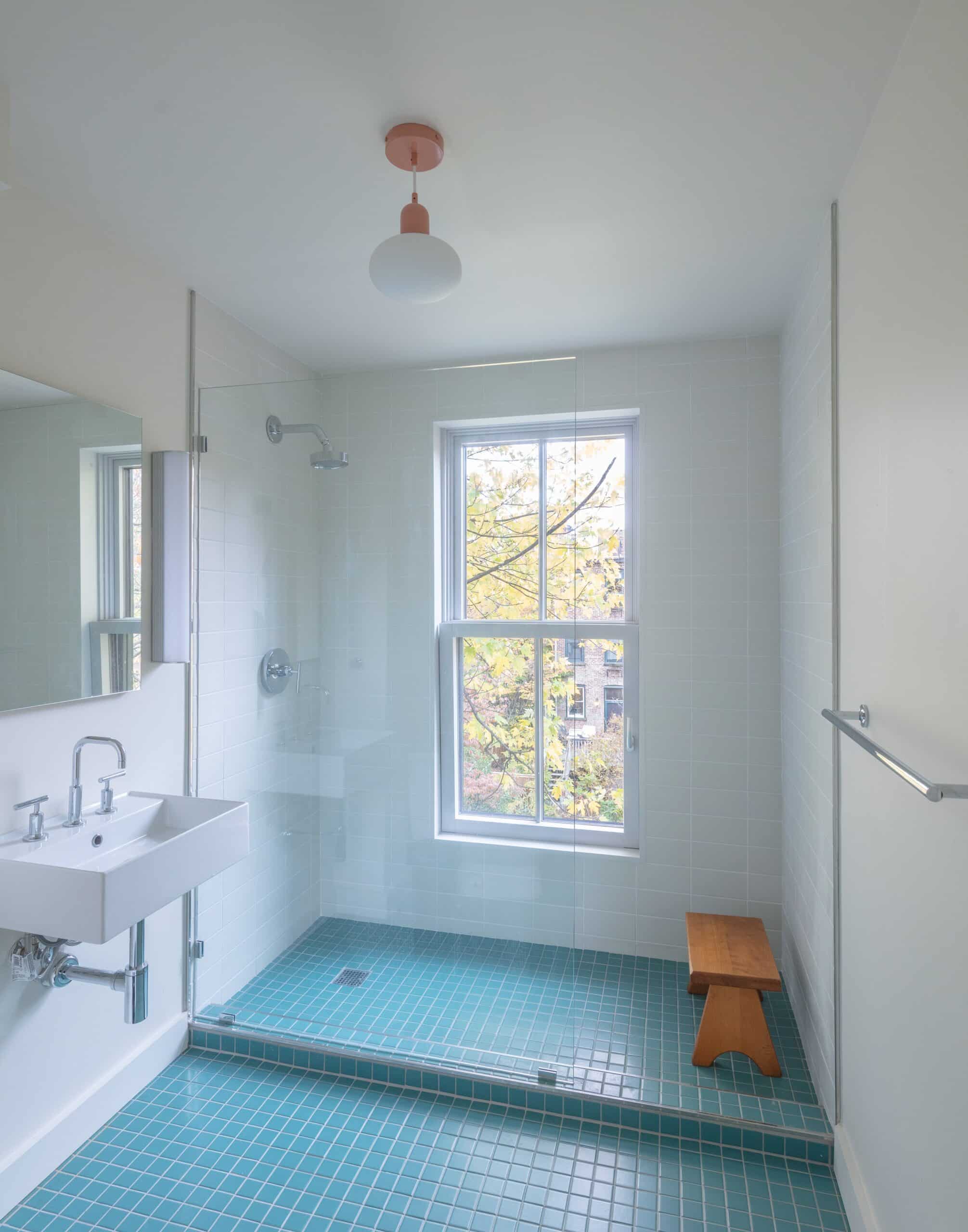 BATHROOM WITH BLUE TILE FLOOR