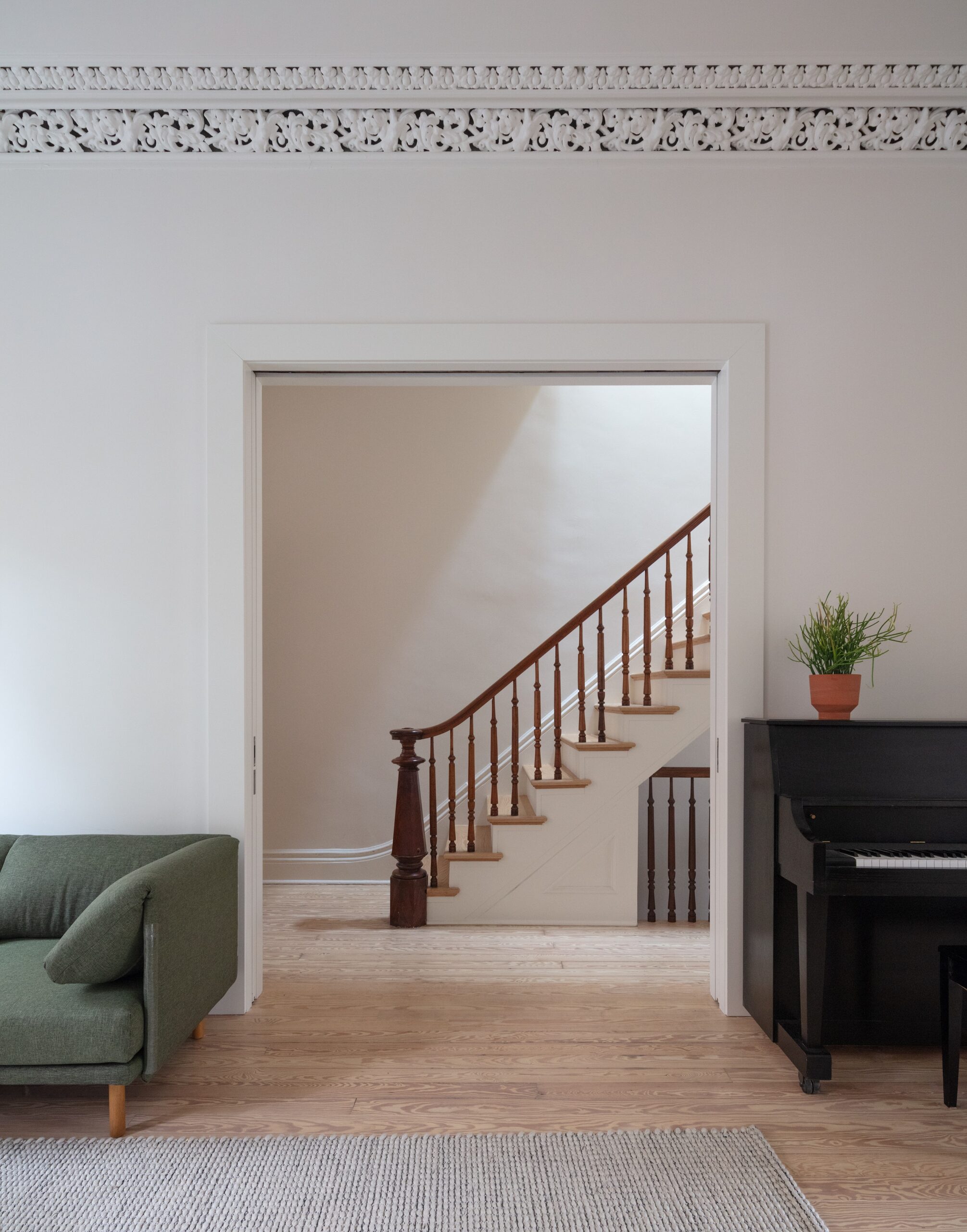 FRONT LOUNGE OPENING TO STAIRCASE