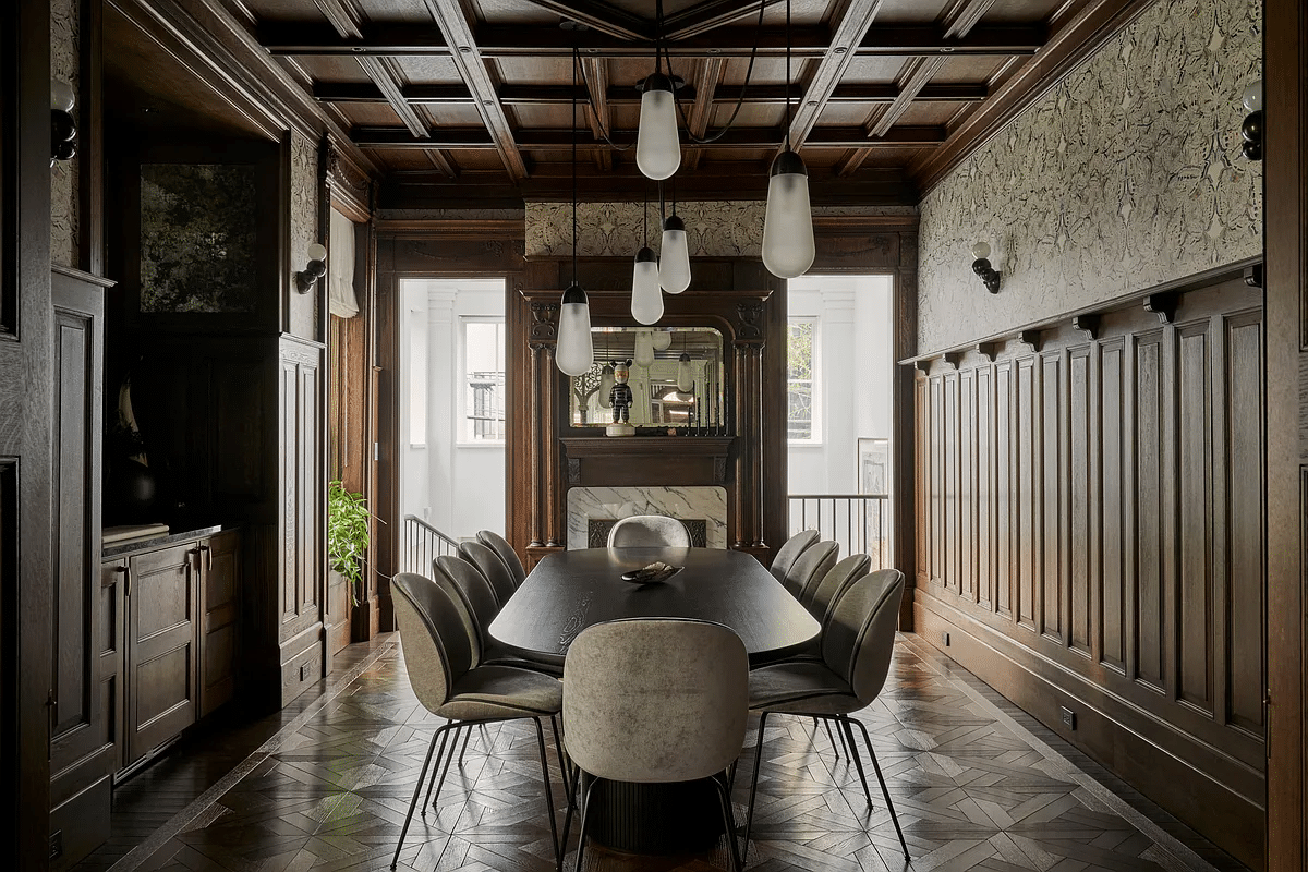 dining room with wainscoting, plate rail, coffered ceiling