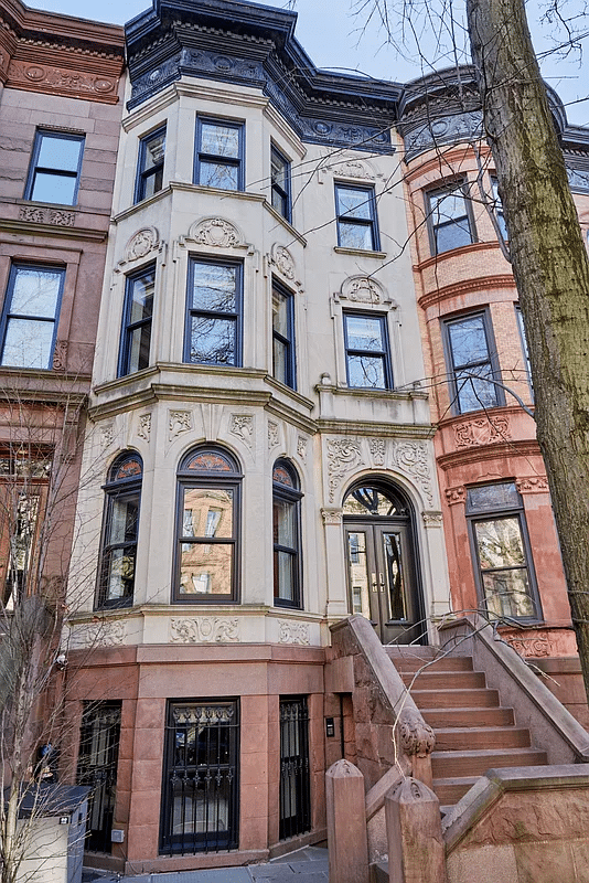 limestone exterior with brownstone base, stoop