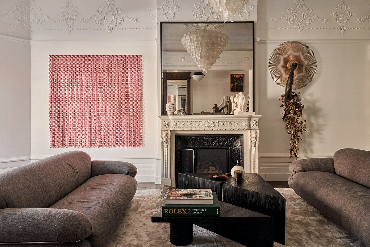 parlor with plasterwork and a later mantel