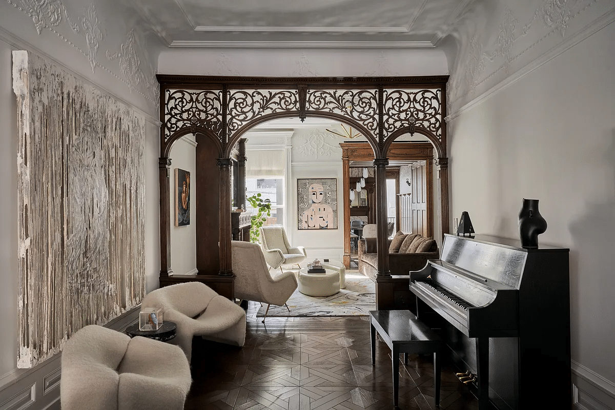 parlor with columned screen and plasterwork