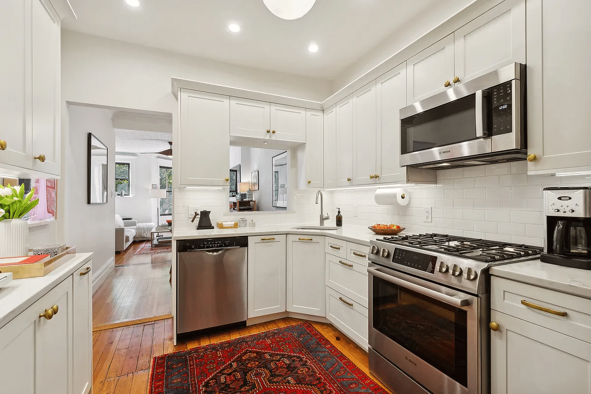 kitchen with white cabinets, stainless steel appliances including a dishwasher