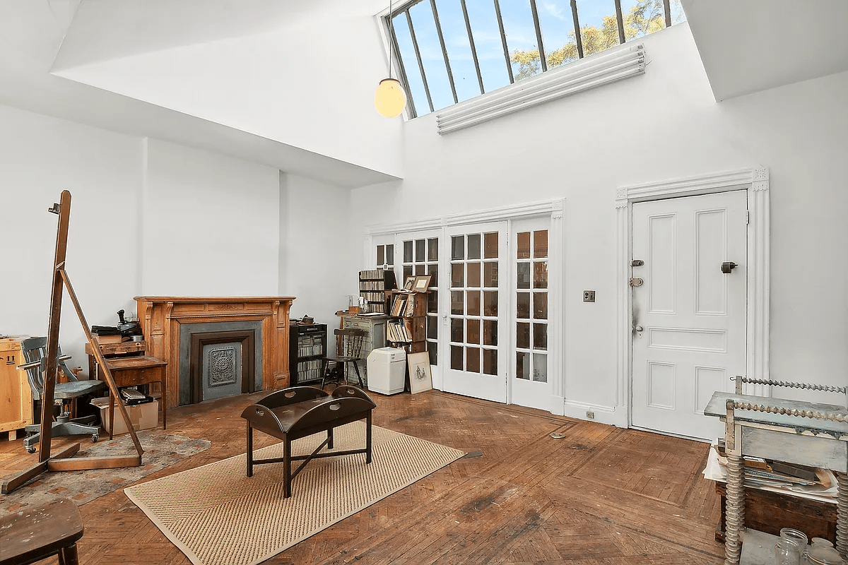 top floor bedroom with skylight set up as a studio space