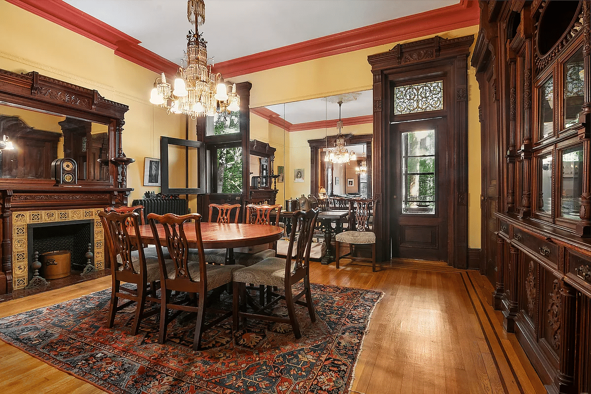 dining room with built-ins, mantel