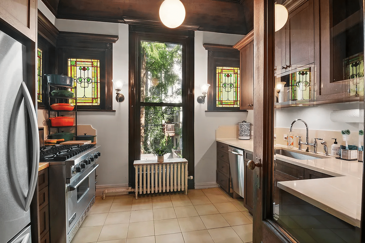 kitchen with wood cabinets, beige counters and tile floor