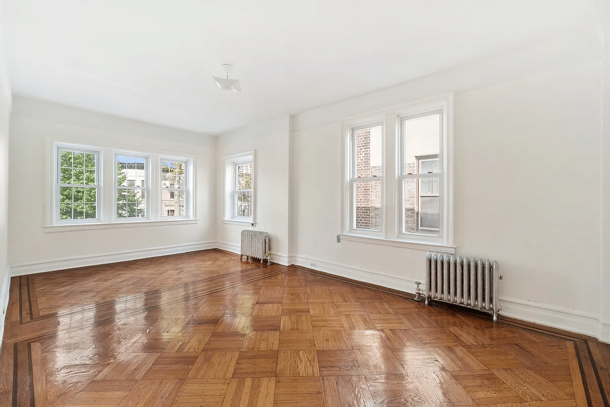 living room with two exposures, wood floor