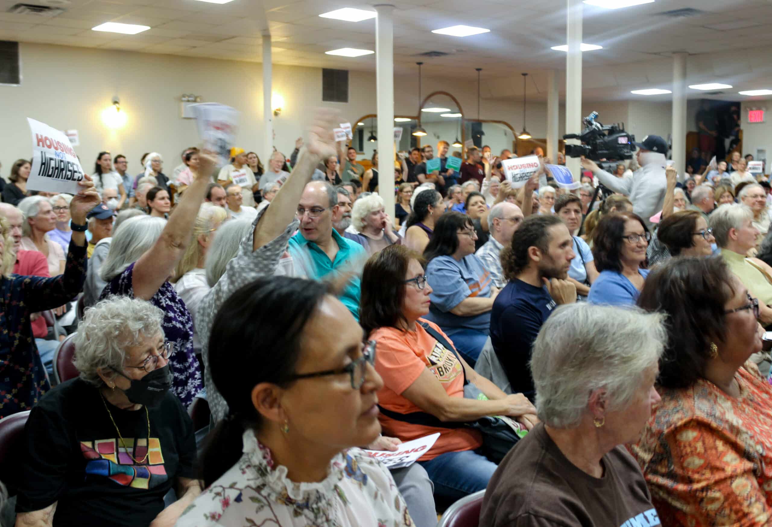 view of the crowd with raised hands