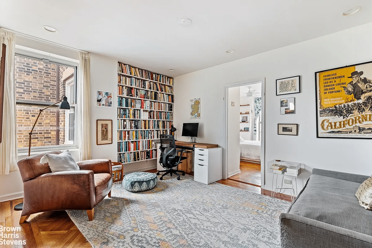 living room with wood floor and view to kitchen