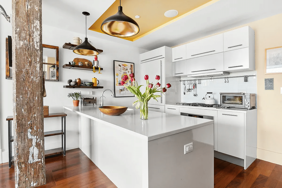 kitchen with white cabinets and island