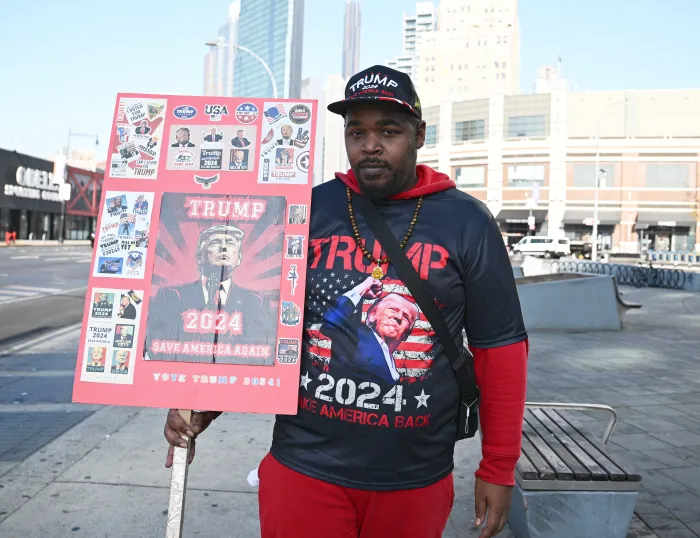 Brooklynite David Massey shows his support for Donald Trump near Barclays Center on Election Day.