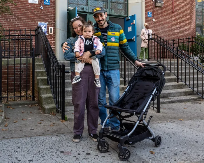 Park Slopers Danielle Stouck and Zach Press voted at M.S. 51 with their young daughter Esther.