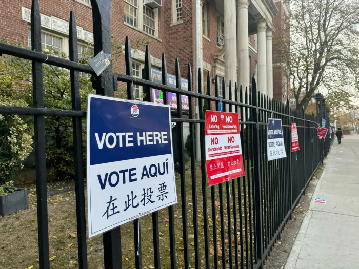 Signs lead to the polling site at P.S./I.S. 180 in Brooklyn on November 5, 2024.