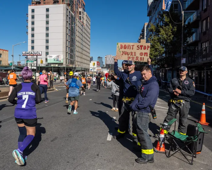 firefighters watching the runners