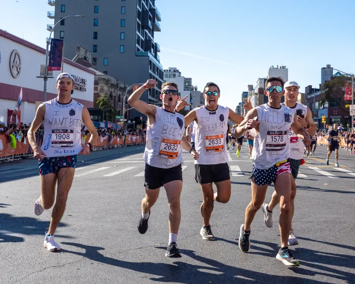 runners with shirts with text requesting beer