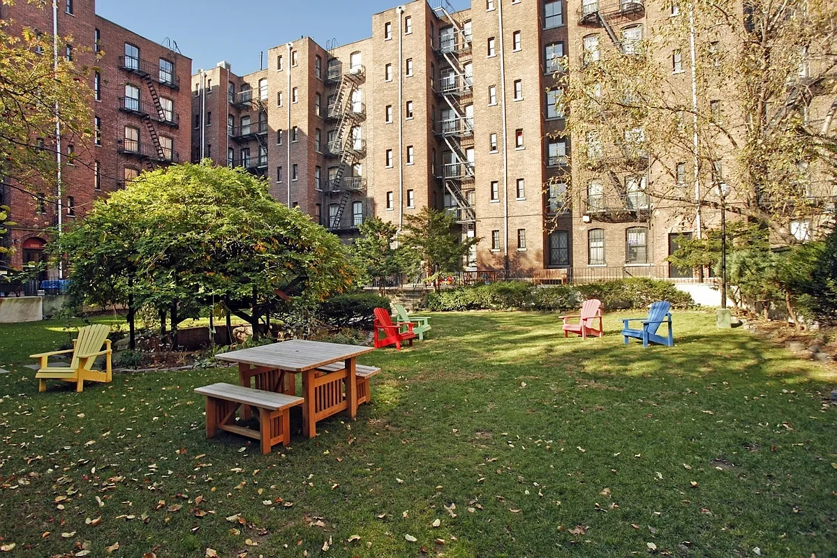 interior courtyard with lawn with seating and trees