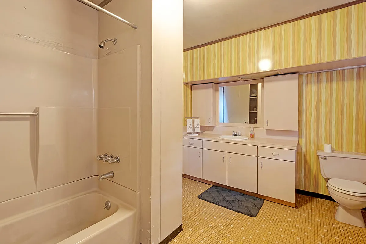 bathroom with yellow floor tile